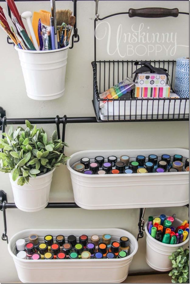 Use Buckets and Hooks For Storage Solution | 26 Craft Room Ideas Every Crafter Would Love